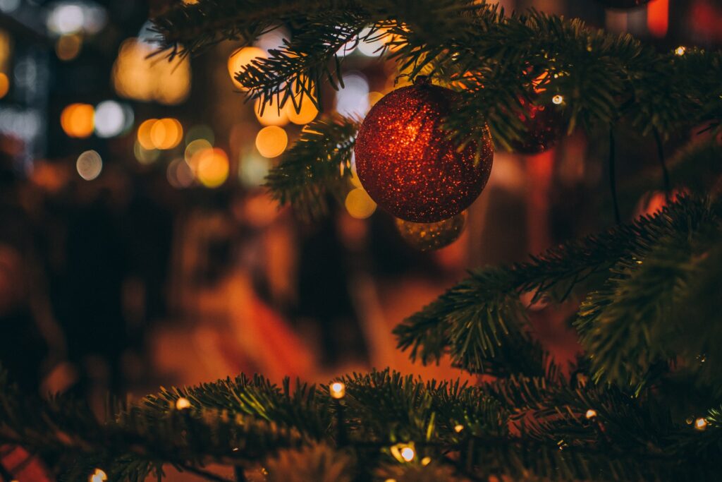 chistmas events grimsby header image of a Christmas tree and bauble in low light and soft focus