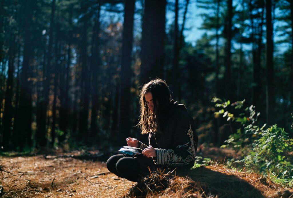 child journaling outdoors
