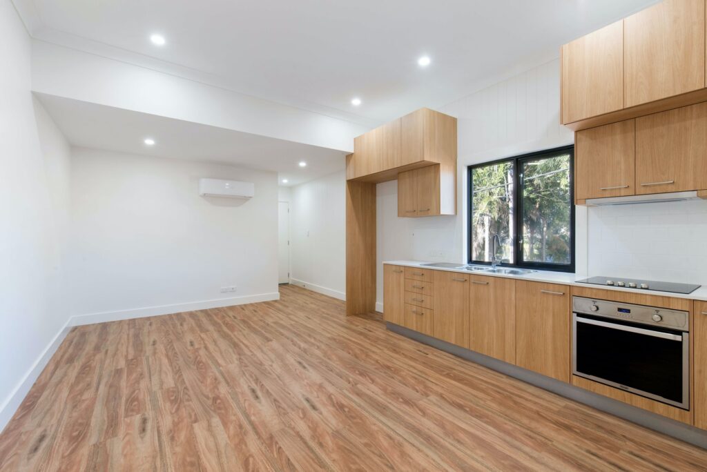 decorating tips for landlords. empty kitchen with laminate flooring