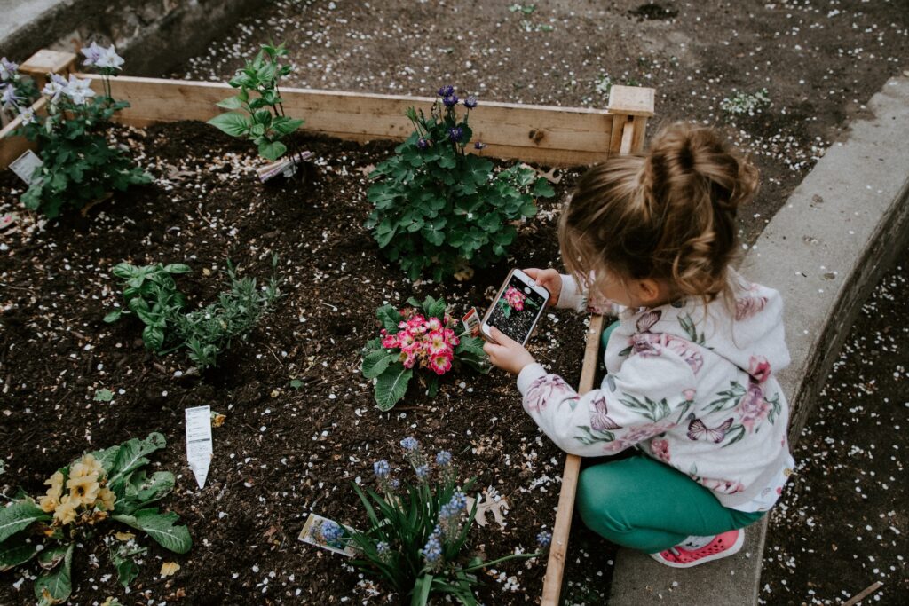 Child planting flowers