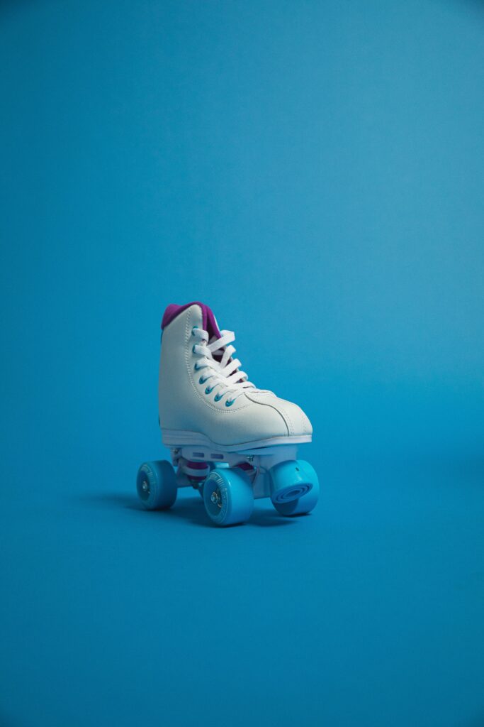 white roller skate on a blue background