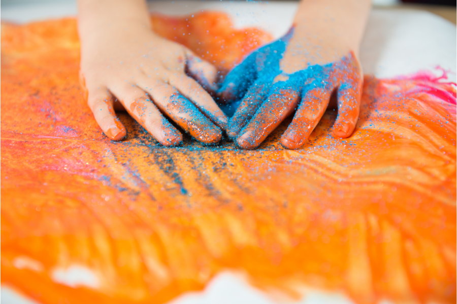 messy play hands in paint