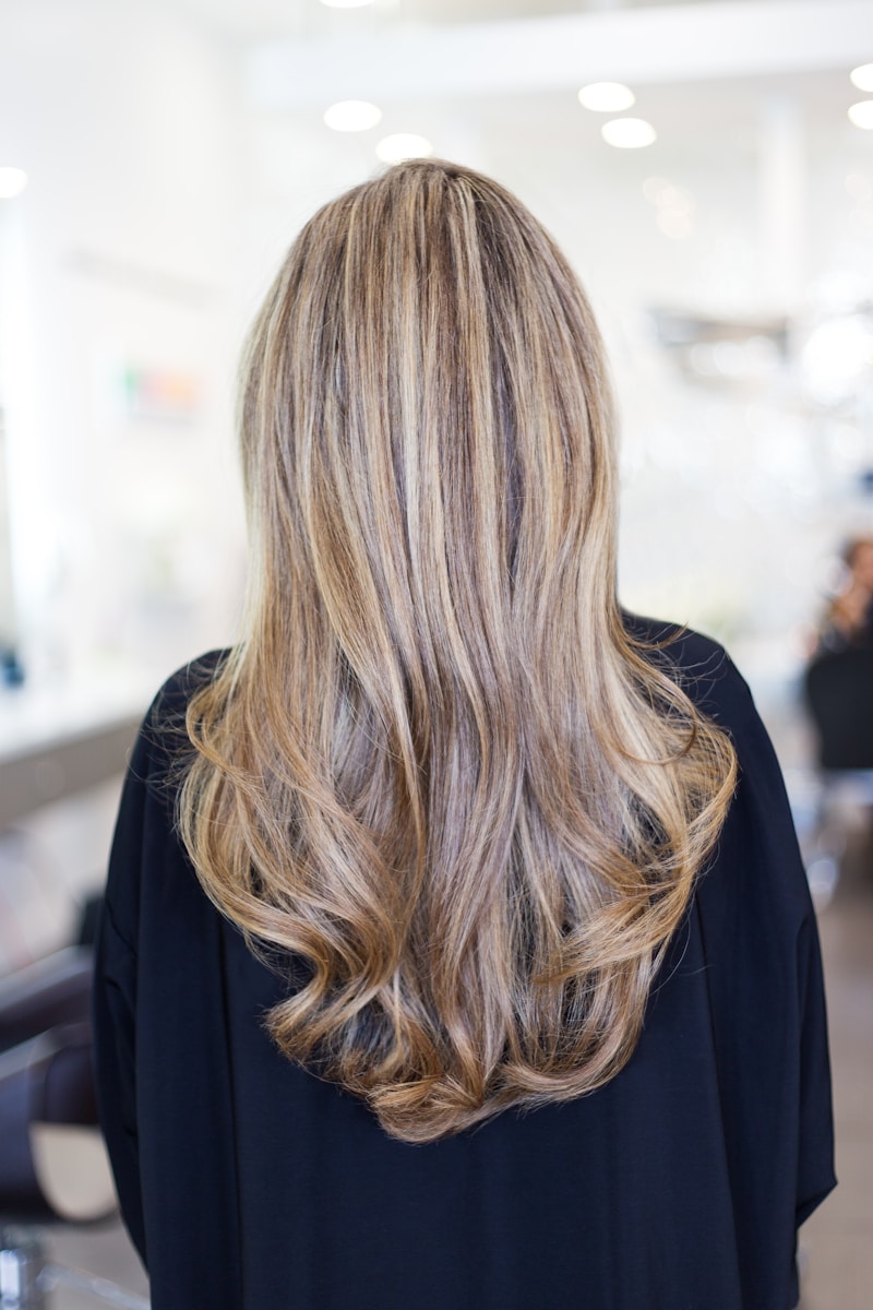 person wearing black top how to achieve the perfect blow dry